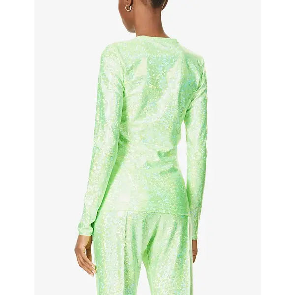 Person wearing a green SHIMMER outfit on a white background