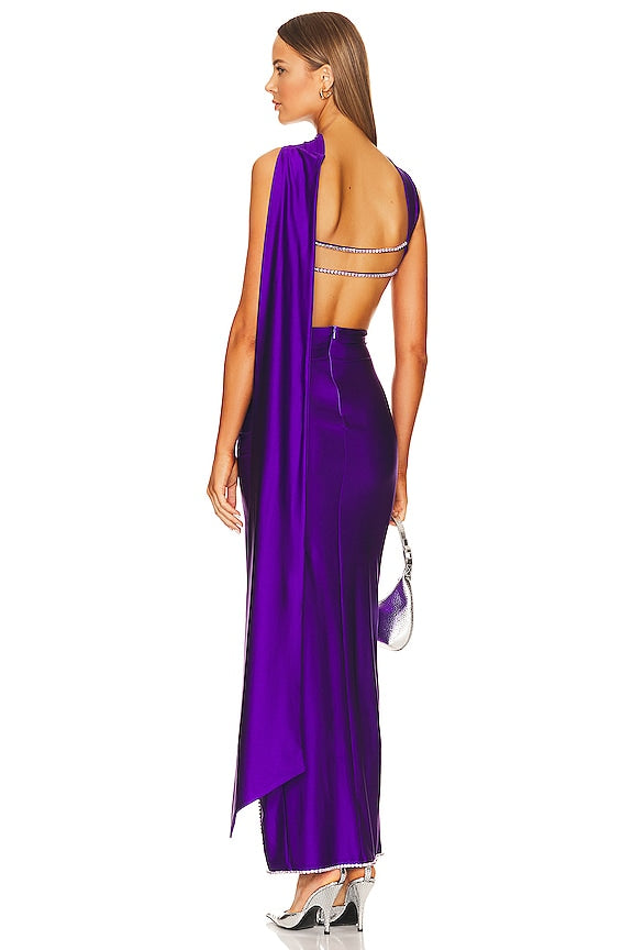 Woman wearing a purple evening gown with a white background